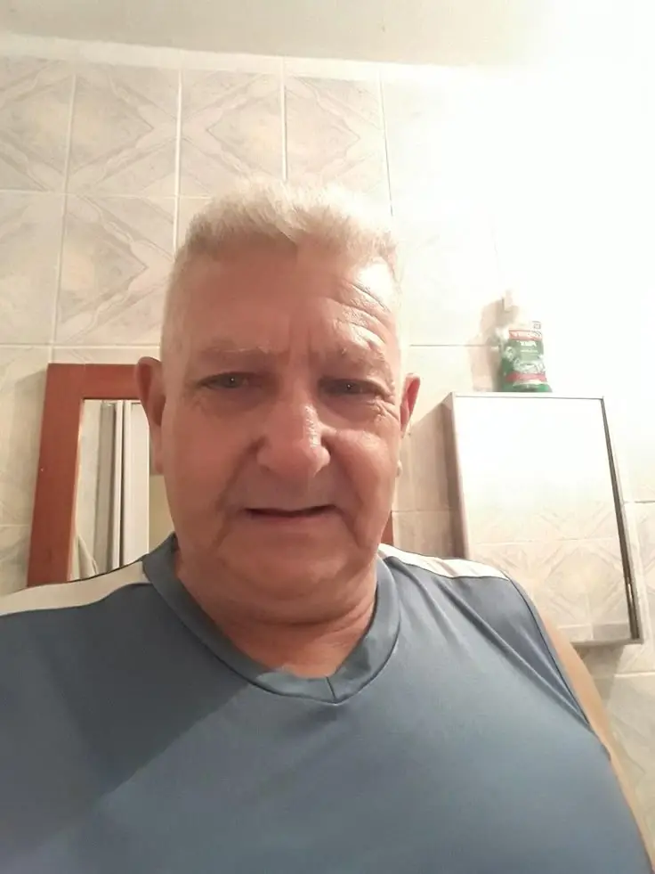 Older man in bathroom selfie